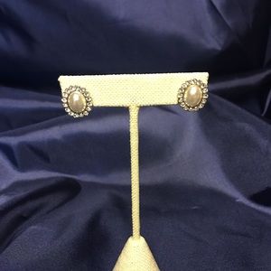 Pearl earrings surrounded by crystals